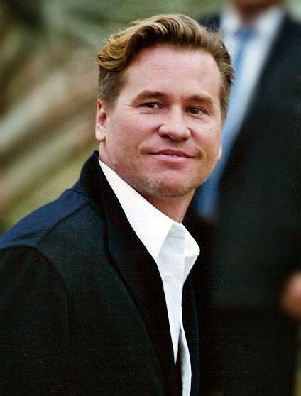 Val kilmer wikipedia - The film's most wrenching scene is a long, unedited, stationary shot of Kilmer seated at a card table at a fan convention, signing autograph after autograph until he feels queasy and has to excuse himself. He then rises unsteadily to his feet, plops down an out-of-focus sofa in the background of the shot, and pukes into a trash can (the sound ...